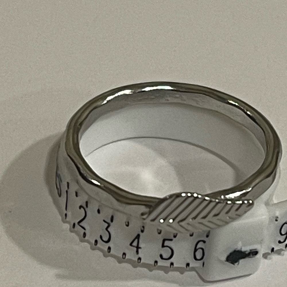 Silver toned hammered feather ring​​​​​​​​